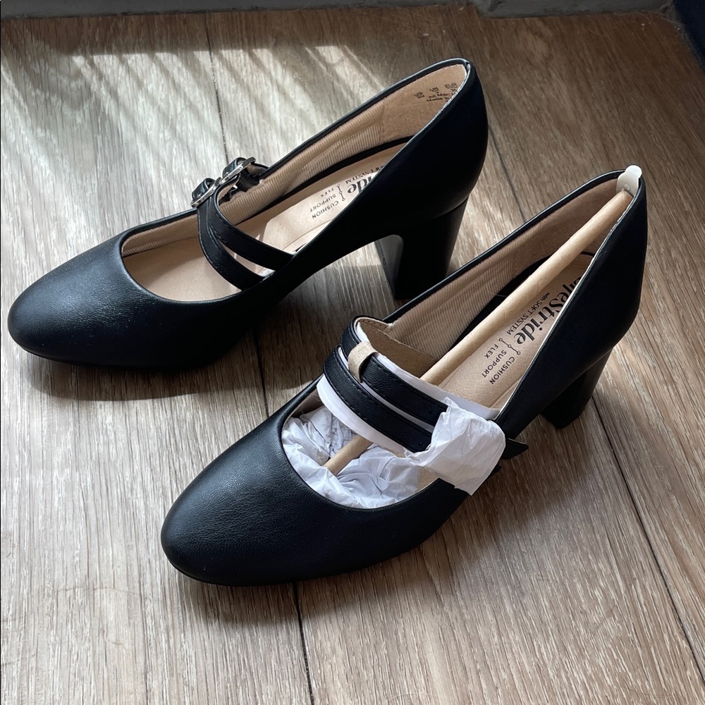 Woman’s black heeled Mary Jane’s.